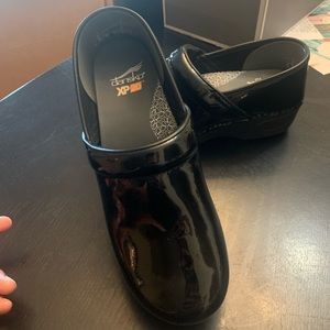 Dansko patent black, wore once inside never outdoors.